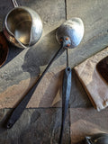 (Modern colonial-inspired handmade serving spoon crafted in stainless steel.)