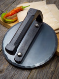 hand forged carbon steel smash burger press closeup